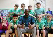 Triple jump champ put pupils through paces