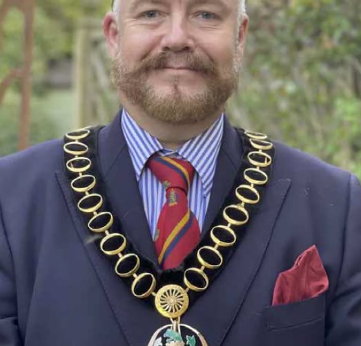 Whitehill & Bordon councillor Adam Carew wearing the chain of the chairman of East Hampshire District Council