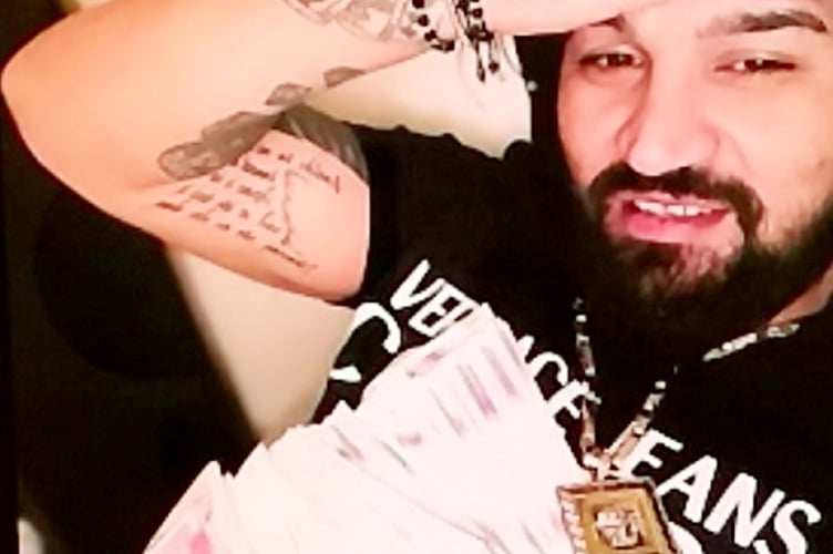 Bogdan Florea - Police found pictures on Florea's phone of him posing with large amounts of cash. A burglar who targeted chemists for perfumes has been jailed for four and a half years. See SWNS story SWNNperfume. Bogdan Florea, 33, from Farnborough, Hampshire, committed a string of offences between July and September 2021. He was caught after his car was spotted near a break-in in Reading, Berkshire. On Monday at Guildford Crown Court, he was sentenced to 54 months jail after pleading guilty to burglary and possession of false ID. Two cars belonging to him were also ordered to be seized and destroyed.