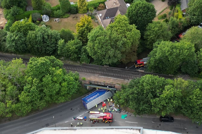 Emergency services on the scene at the A325 Wrecclesham railway bridge after an HGV struck the bridge at around 6.15pm on Monday