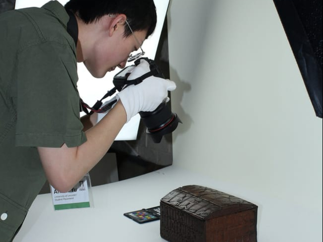 Student Anson Yu at work photographing some of the Icelandic collection