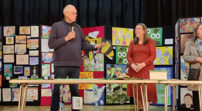 Exhibition secretary Kaye Garrett and artist Roger Dellar in front of the children’s work during the opening of the Alton Art Society’s annual exhibition at the preview evening on October 7th 2022.