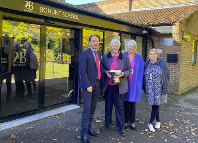 The Liphook Women’s Institute Centenary Cup is presented to Bohunt School in Liphook, October 2022. From left: Head Neil Strowger, WI president Judy Evans, WI secretary Muriel Bullingham and head of sixth form Clare Hodgson.