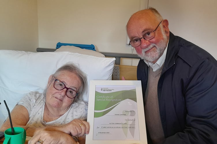 Denise Graham receives a Certificate of Special Recognition from Alton Community Care chairman Bill Griffin, November 2022.