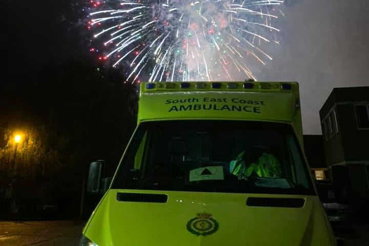 Ambulance lit by firework