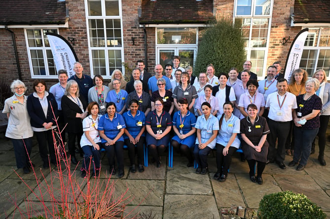 A new photo of the present-day staff at Haslemere Hospital, which has grown since 1923 to provide a wide range of NHS services