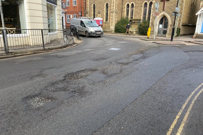 The road surface at the junction of South Street and Union Road is breaking up after the recent cold snap. This photo was taken on Tuesday (January 31) afternoon, when the sub-layer of the road was clearly visible and gravel was strewn across the highway. The Herald has shared these images with Surrey County Council.