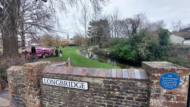 The Extinction Rebellion pink boat and plaque in Gostrey Meadow, Farnham