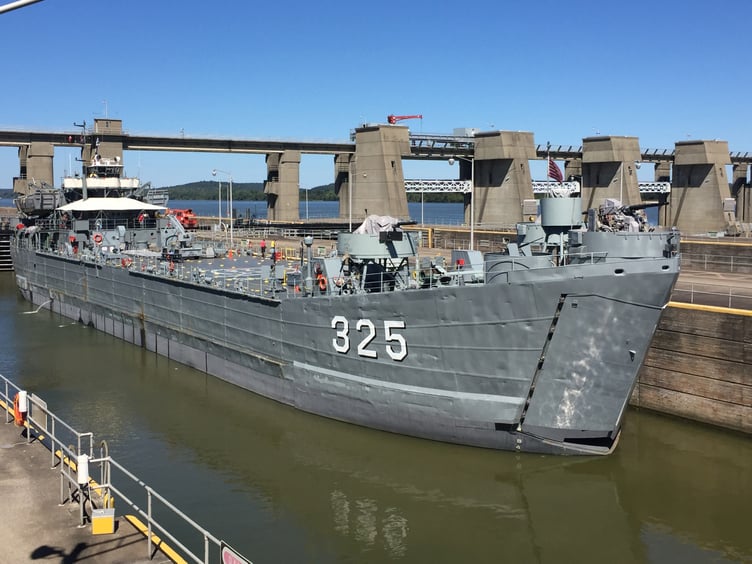 The USS LST-325 passes through Smithland Locks and Dam on the Ohio River at Brookport, Illinois. LST-325 is a decommissioned tank landing ship of the United States Navy, now docked in Evansville, Indiana.