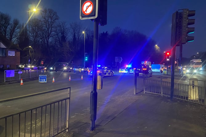One police car, an ambulance and a critical care paramedic attended the incident at the A31 Hickleys Corner junction on Monday. A dark car could also be seen pulled up just beyond the junction close to the Brightwells Yard construction entrance.