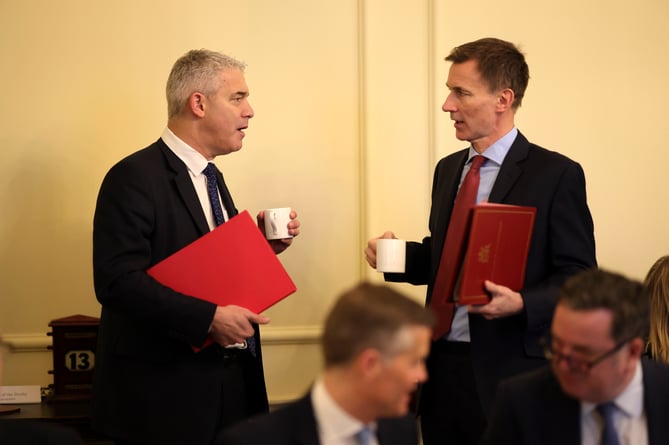 Health Secretary Steve Barclay and Chancellor of the Exchequer Jeremy Hunt talk before Prime Minister Rishi Sunak holds his weekly Cabinet meeting from 10 Downing Street