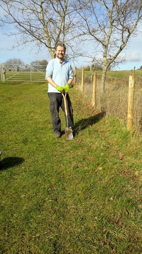 Alton Climate Action Network's project manager Scott Goldie digging at the Greenfields site
