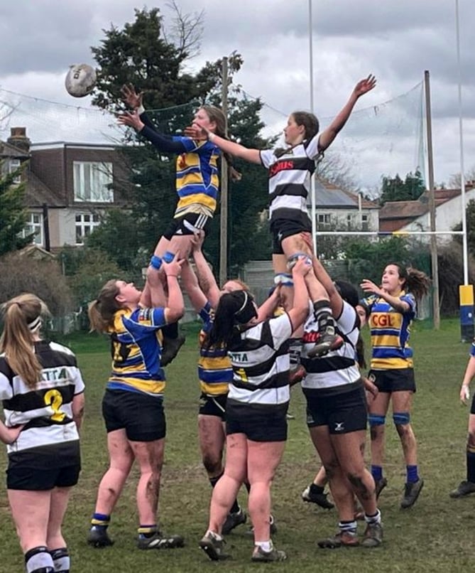 Eva Pressly is expertly lifted in the lineout by Chelsey Reed and Ella Barker