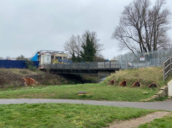 Planning permission was granted for Crest Nicholson's temporary Brightwells Yard construction access to the A31 in 2018. Once the development is complete, the bridge will be dismantled and replaced with a permanent bridge for pedestrians – and possibly cyclists too...