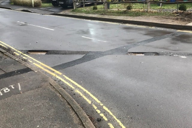 Pot holes in Forest Road, Whitehill, March 2023.