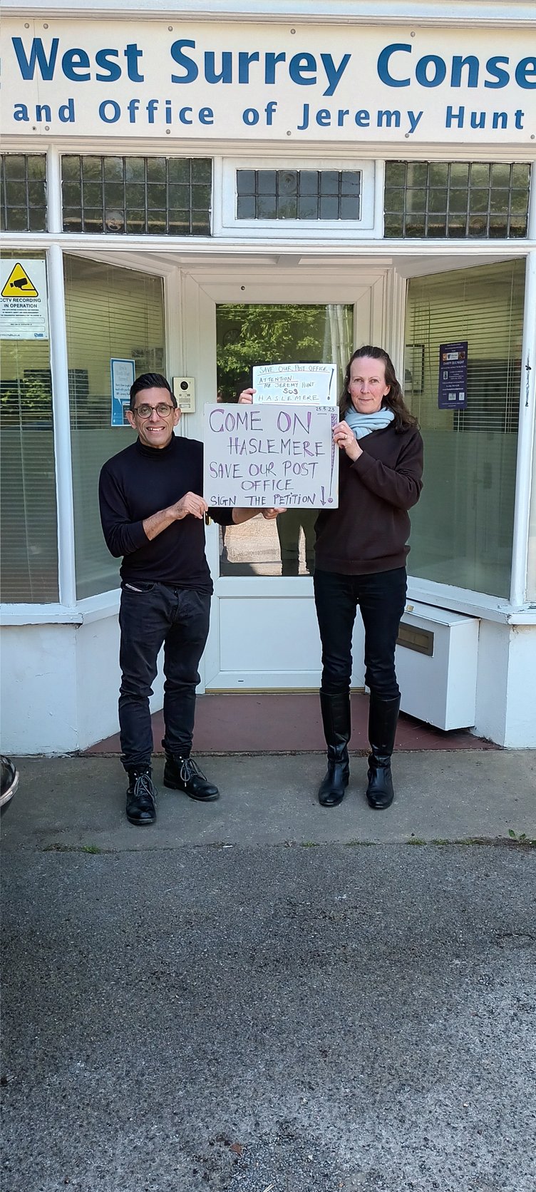 Zara Howard, a member of Jeremy Hunt MP’s Hindhead constituency team, accepting a petition from Haslemere resident Anil Sharma on behalf of the MP