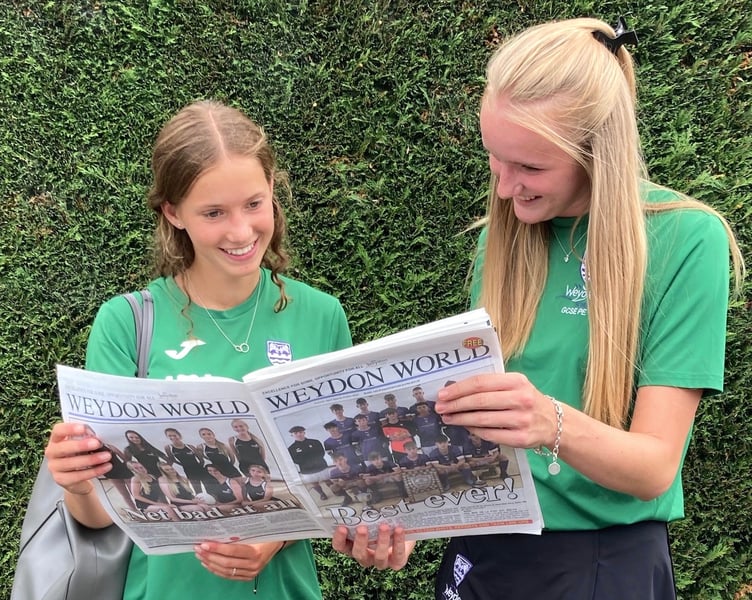 Students reading the first edition of Weydon World in July 2022