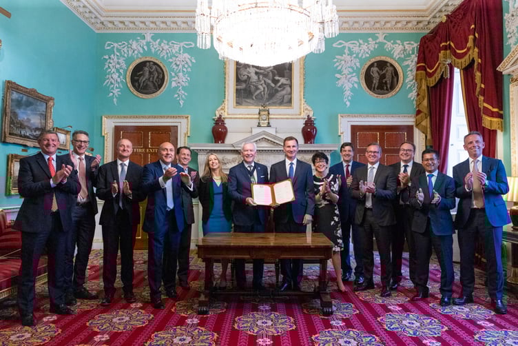 Chancellor Jeremy Hunt and The Lord Mayor Nicholas Lyons, with the signed Mansion House Compact, before the Chancellor delivered his speech at Mansion House in London PHOTO: KIRSTY O’CONNOR/HM TREASURY