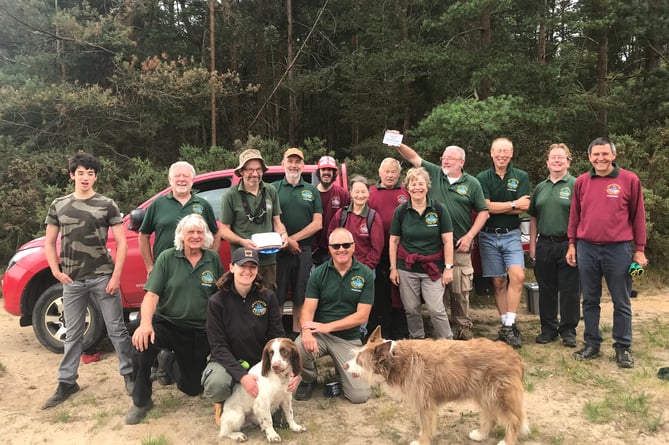 Deadwater Valley Trust staff and volunteers celebrate Hogmoor Inclosure winning The Land Trust’s Site Of The Year award, July 3rd 2023.