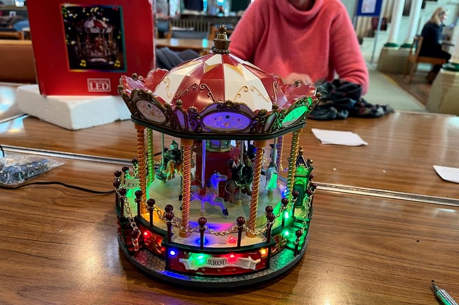 The Christmas carousel in full working order after Farnham Repair Cafe worked its magic – with the help of a 3D printer