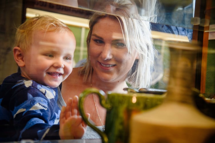 Looking at ceramics in the Allen Gallery, Alton.