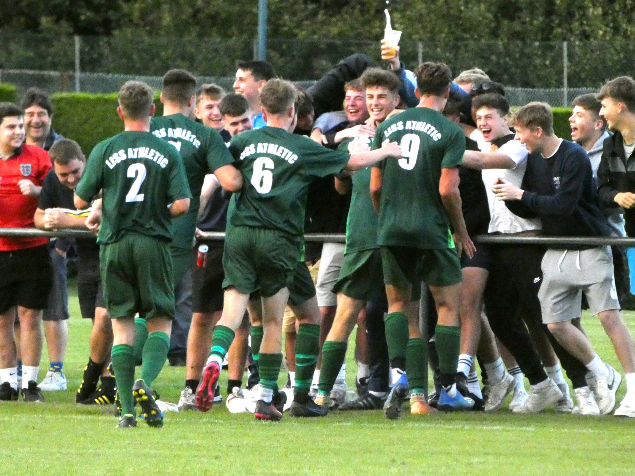 Liss Athletic players celebrate with their fans at Liphook United