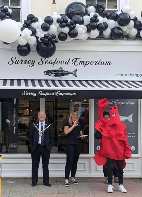 Farnham's mayor Alan Earwaker with a giant lobster at the opening of the Surrey Seafood Emporium in Downing Street