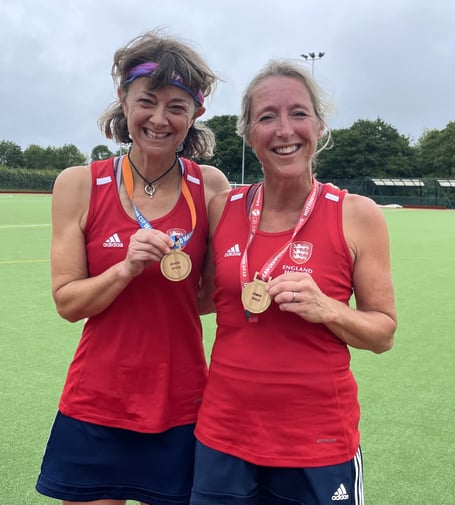 Haslemere Hockey Club team-mates Heidi Wells (left) and Mel Redman pictured with their gold medals
