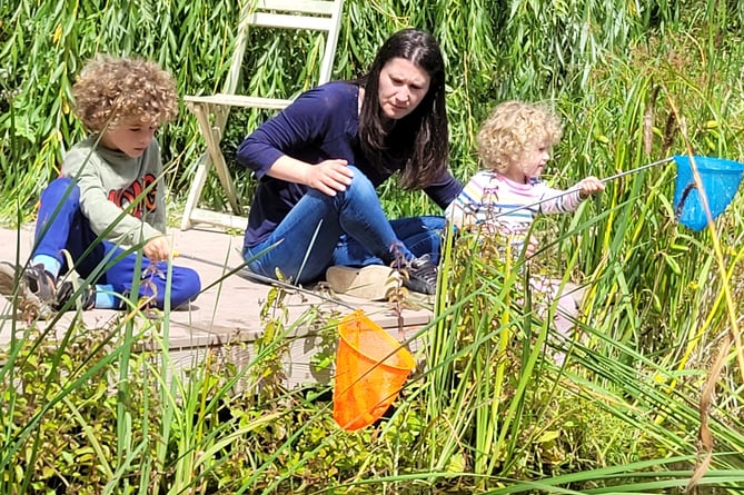 A family pond-dipping at Space2Grow in Farnham