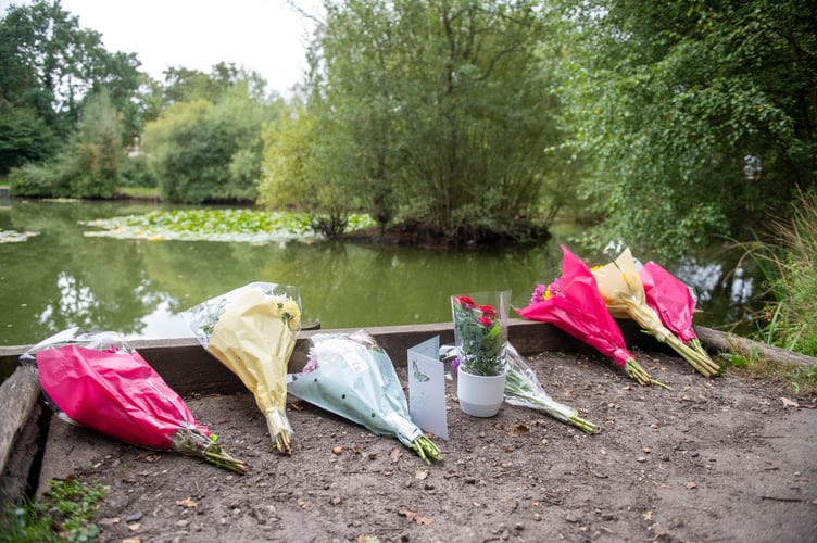 Flowers at Kingsley Pond after a woman has been arrested on suspicion of murder after a two-year-old girl died last night having been found in the village pond the day before. Kingsley, Hampshire, 12th September 2023. See SWNS story SWBNpond.
