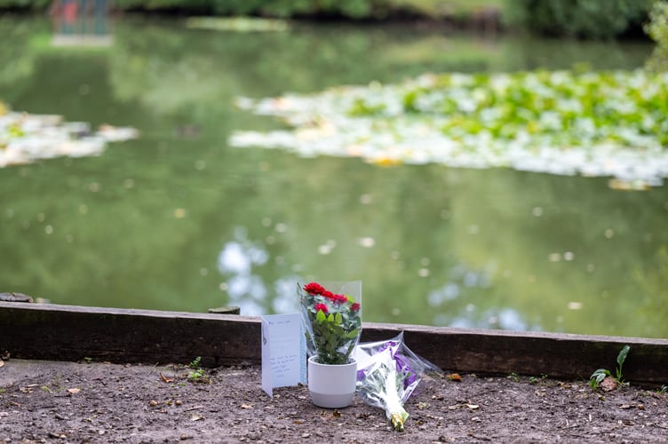 Flowers at Kingsley Pond after a woman has been arrested on suspicion of murder after a two-year-old girl died last night having been found in the village pond the day before. Kingsley, Hampshire, 12th September 2023 See SWNS story SWBNpond