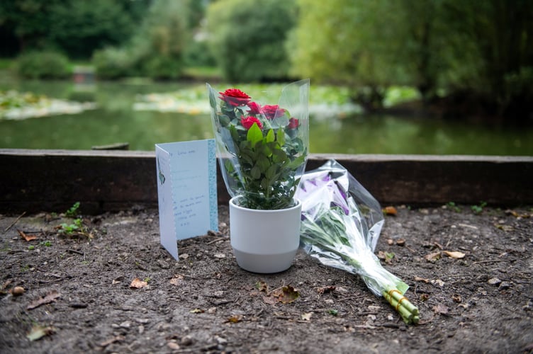 Flowers at Kingsley Pond after a woman has been arrested on suspicion of murder after a two-year-old girl died last night having been found in the village pond the day before. Kingsley, Hampshire, 12th September 2023 See SWNS story SWBNpond