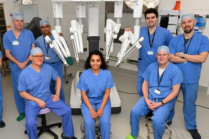 Robot and surgeons at the Royal Surrey County Hospital in Guildford