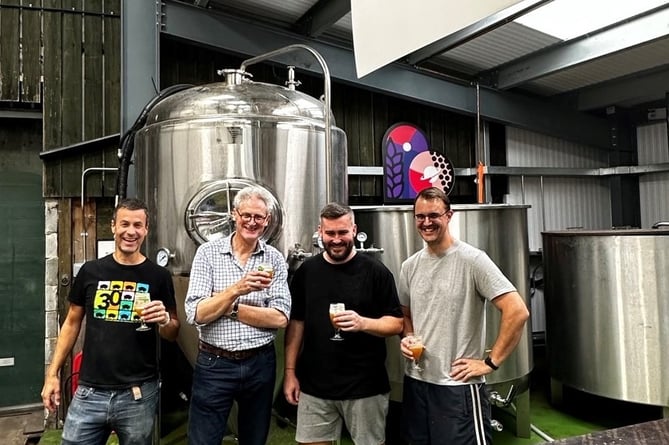 Miles Chesterman, head brewer; Rupert Thompson, Hogs Back managing director; Mark Andrews, brewer and Stephen Holland, lead brewer, in the One Planet Brewing brewery in Tongham, Surrey
