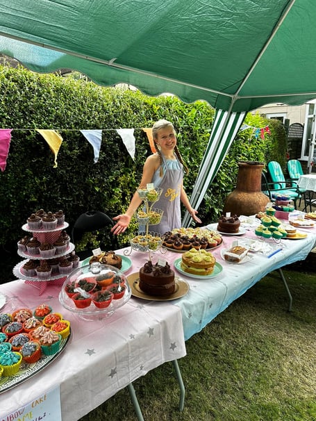 Brooke with her amazing display of cakes, baked in aid of charity Children With Cancer