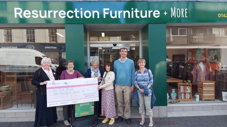 Resurrection Furniture, Alton High Street, hands over a £1,000 cheque to the Pink Place Alton, October 2023.