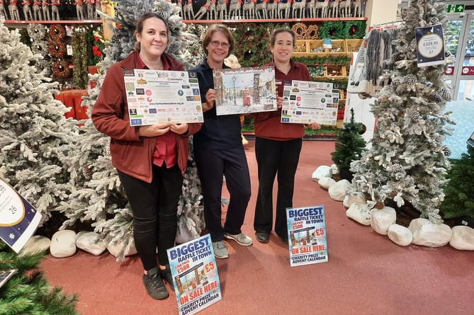Farnham Lion Deborah Nugent with Squires staff members Debbie Hook and Lizzie Winton at the launch of Farnham Lions' Charity Advent Calendar