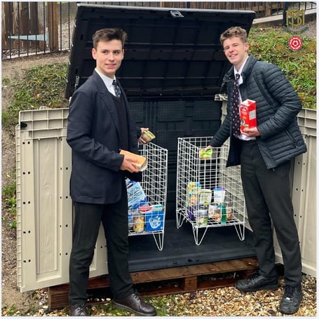 More House students Rufus and James with the Frensham school's new Farnham Foodbank collection point