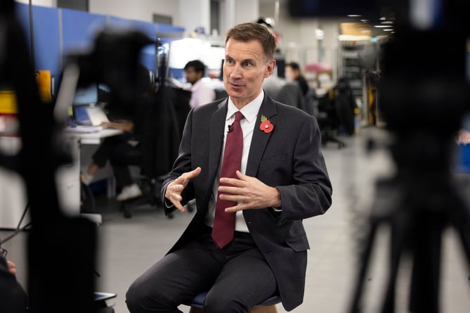 Chancellor Jeremy Hunt is interviewed at Surrey Research Park in Guildford, after GDP statistics were released