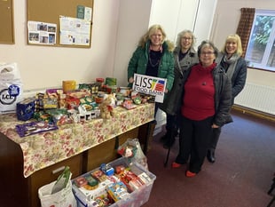 Exercise group makes (keep) fitting donation to Liss Food Bank