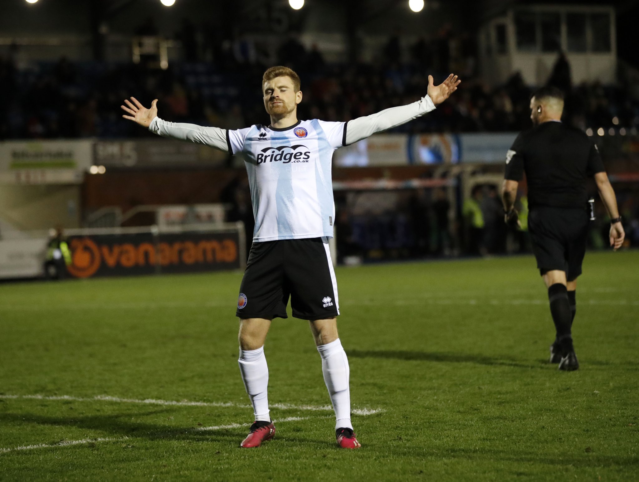 Jack Barham salutes the Shots fans after scoring the decisive penalty