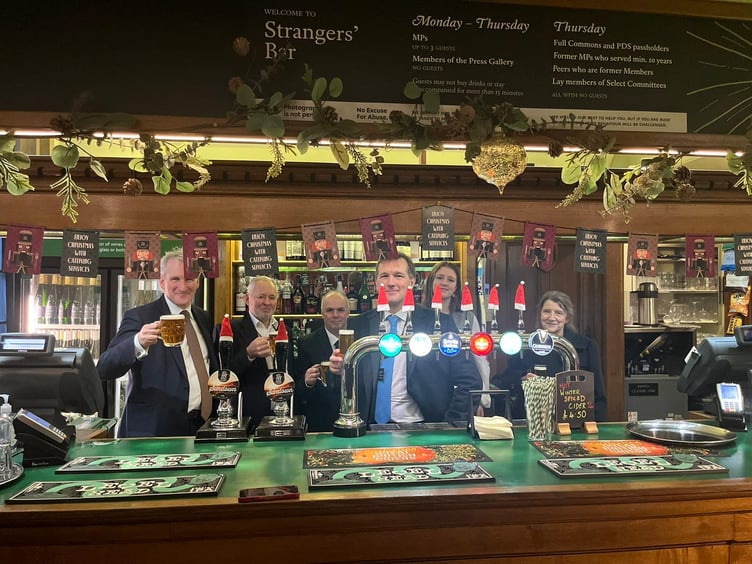 East Hampshire MP Damian Hinds and the Triple fff Brewery team sample Sundown in the Strangers' Bar, House of Commons, December 2023.