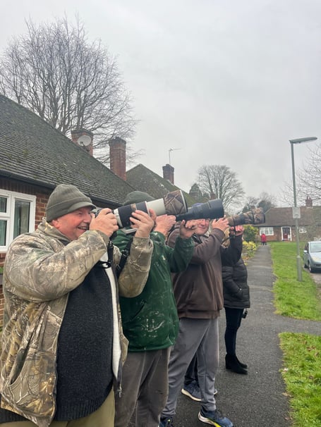 Birdwatchers size up the perfect photo of a wax wing at Haven Way opposite Farnham Hospital