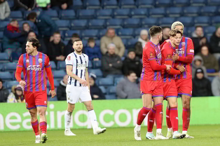 Ollie Bray is congratulated after scoring
