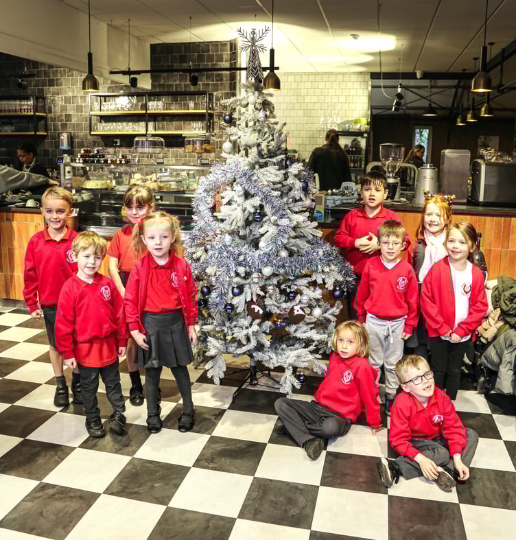 Pupils from Badshot Lea Village Infant School with the finished tree