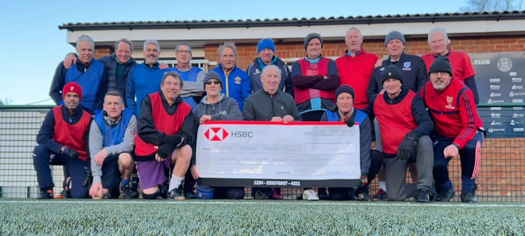 Alton FC walking footballers with cheque for £550 for Bobby Moore Fund, December 2023.