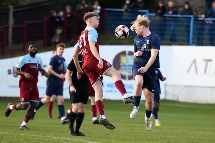 Dean Rule battles for possession during Farnham’s 4-0 win against Horley
