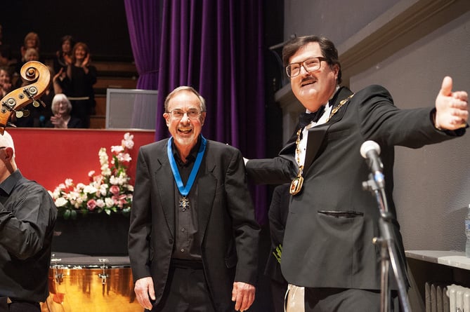 Philip Young receives a Town Mayor's Medal from JC Crissey, Petersfield Festival Hall, March 16th 2024.
