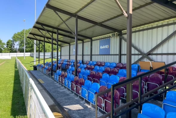 The seats in Badshot Lea's two seated stands have been painted claret and blue
