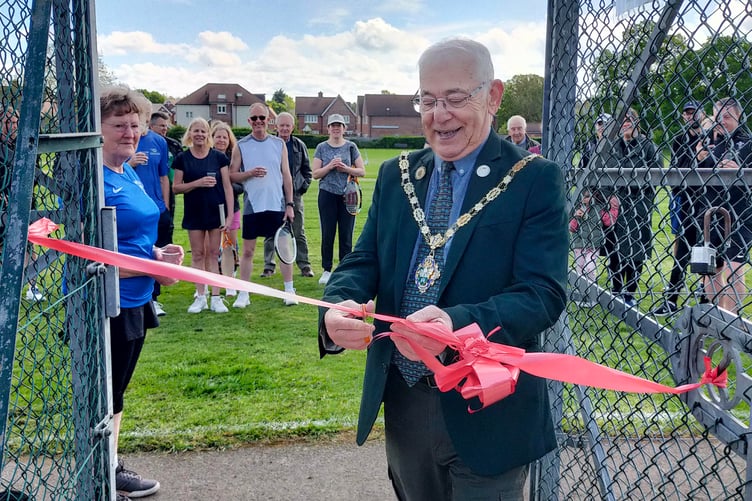 Farnham town councillor Alan Earwaker has formally opened the newly-landscaped area around the refurbished clubhouse at Badshot Lea Tennis Club